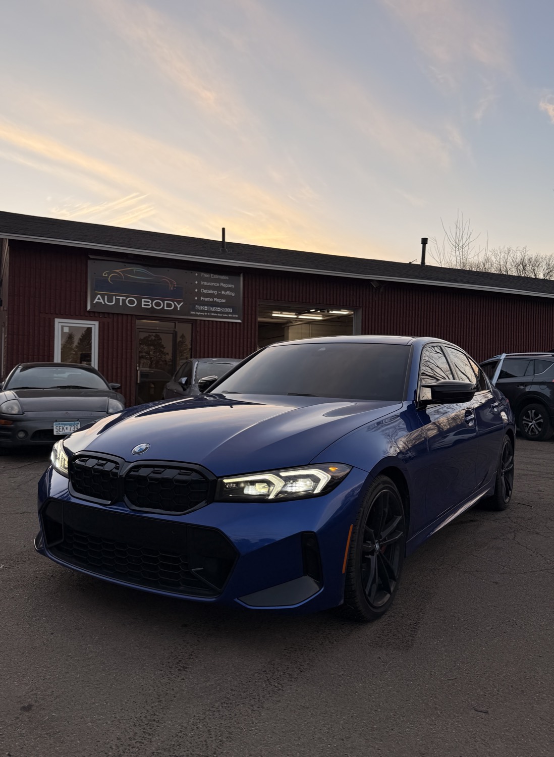Freshly repaired BMW outside Primeline Auto Body in White Bear Lake